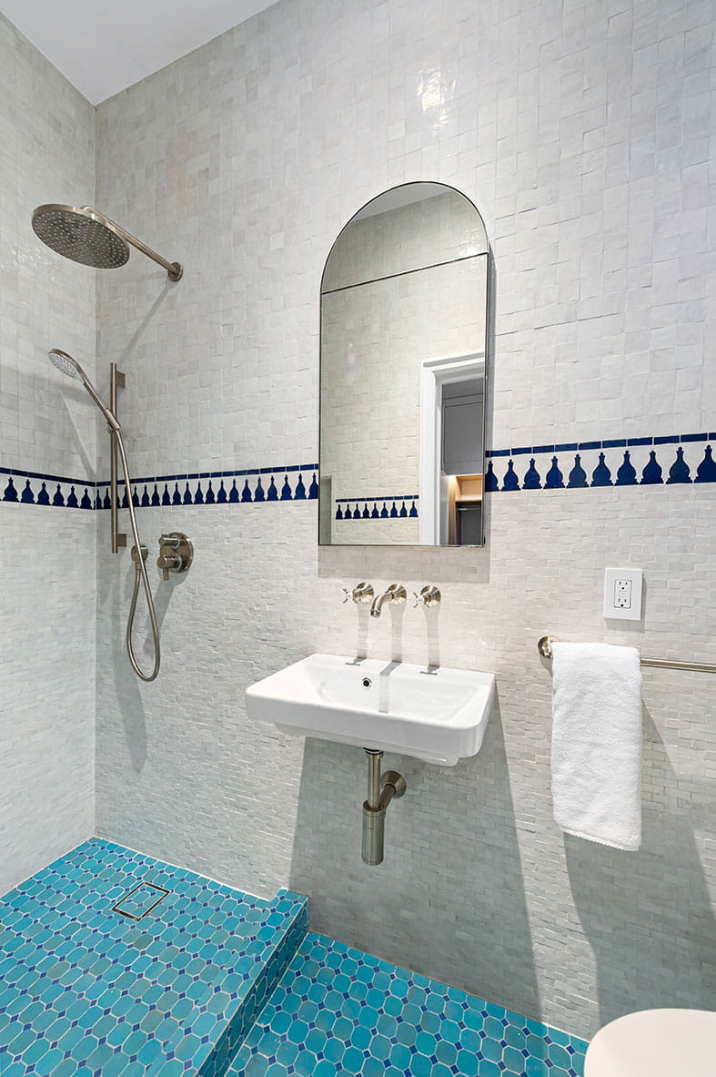 Small shower with in wall sink and recessed medicine cabinet. Floating Vanity.